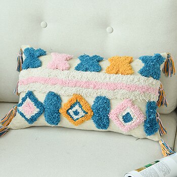 https://rambleroamco.com/cdn/shop/products/Handmade-Luxury-Moroccan-Wool-Throw-Pillows-with-Tassels-Ramble-Roam-718.jpg?v=1679482302&width=350